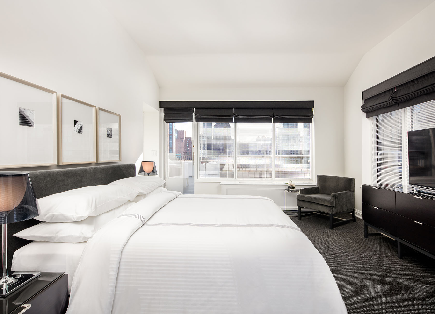AKA Sutton Place furnished apartment spacious bedroom with white linens
